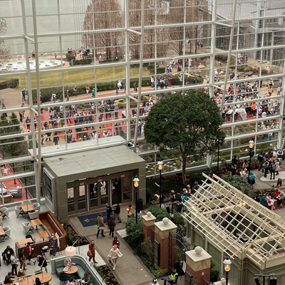 A cosplay meetup fills the garden just outside the atrium.