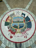 The Seal of Texas sits in the center of the atrium floor.