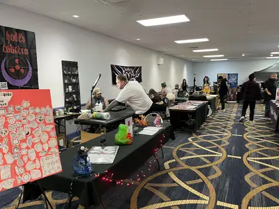 Multiple tattoo artists are setup in their own room.