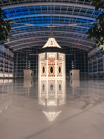 The iconic gazebo reflects across the marble floor.