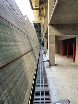 An angled wall in the parking garage