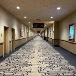 A long hallway in one of the hotel wings. The once brown carpet has been replaced with a brighter and more sophisticated one. Notice the papyrus font type on the sign, which is ubiquitous throughout the resort.