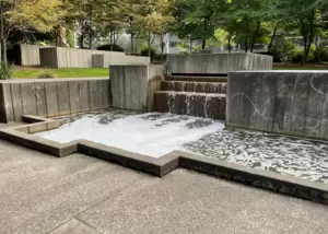 One of many water features in Freeway Park. Unfortunately they aren't running during Sakura-Con. Notice the random homeless person in the top left changing their clothes.